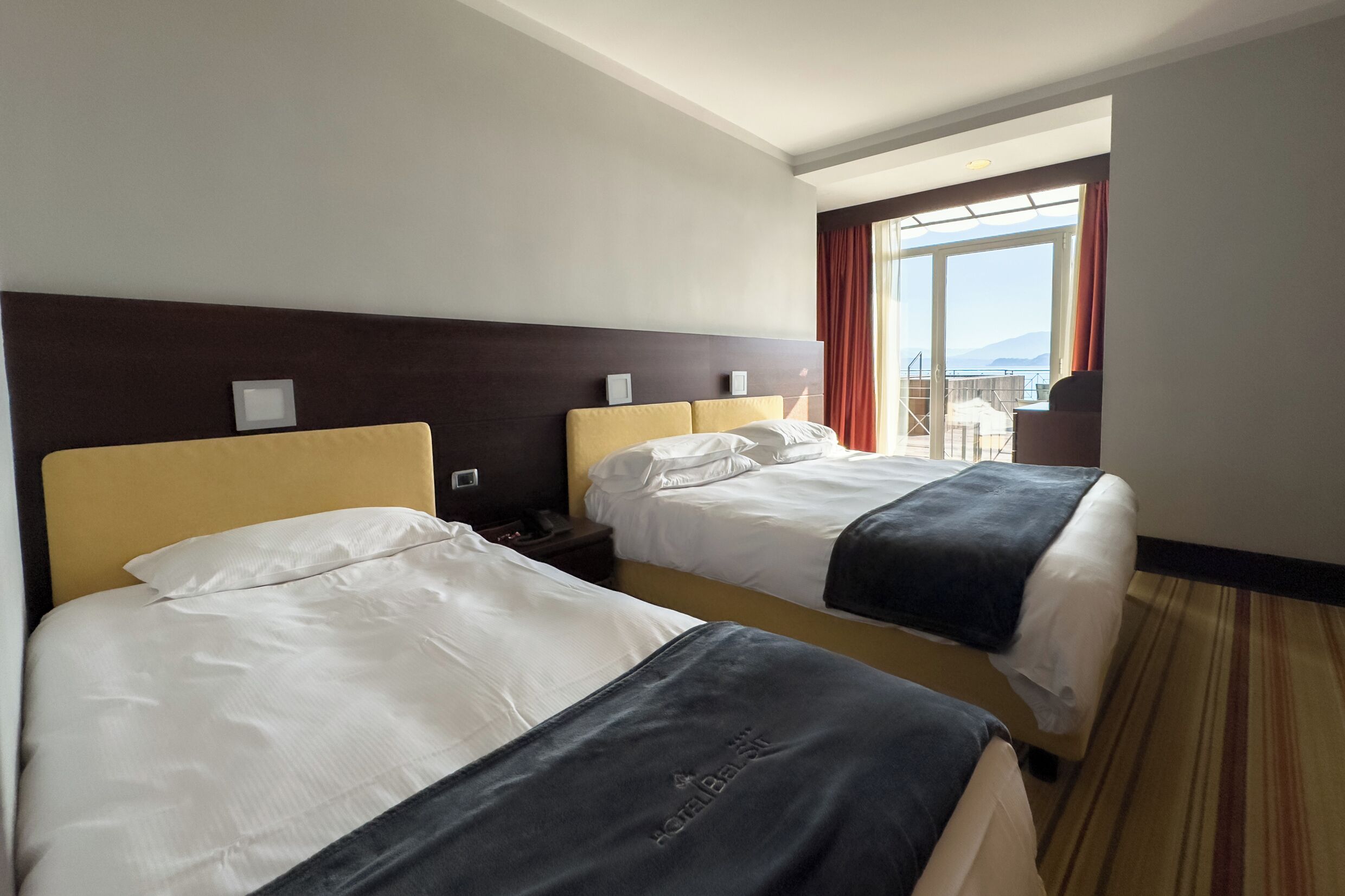 superior triple room, lake view | 1 bedroom, minibar, in-room safe, desk