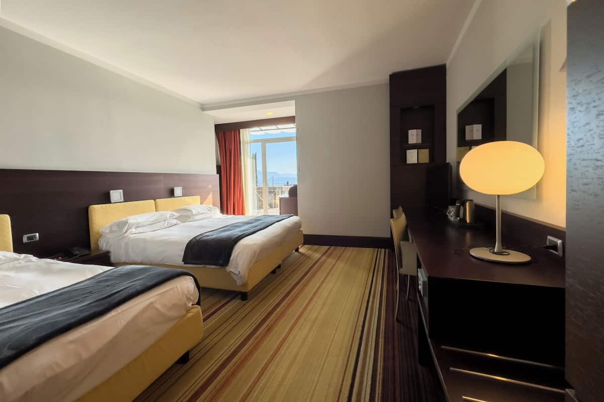 superior triple room, lake view | 1 bedroom, minibar, in-room safe, desk