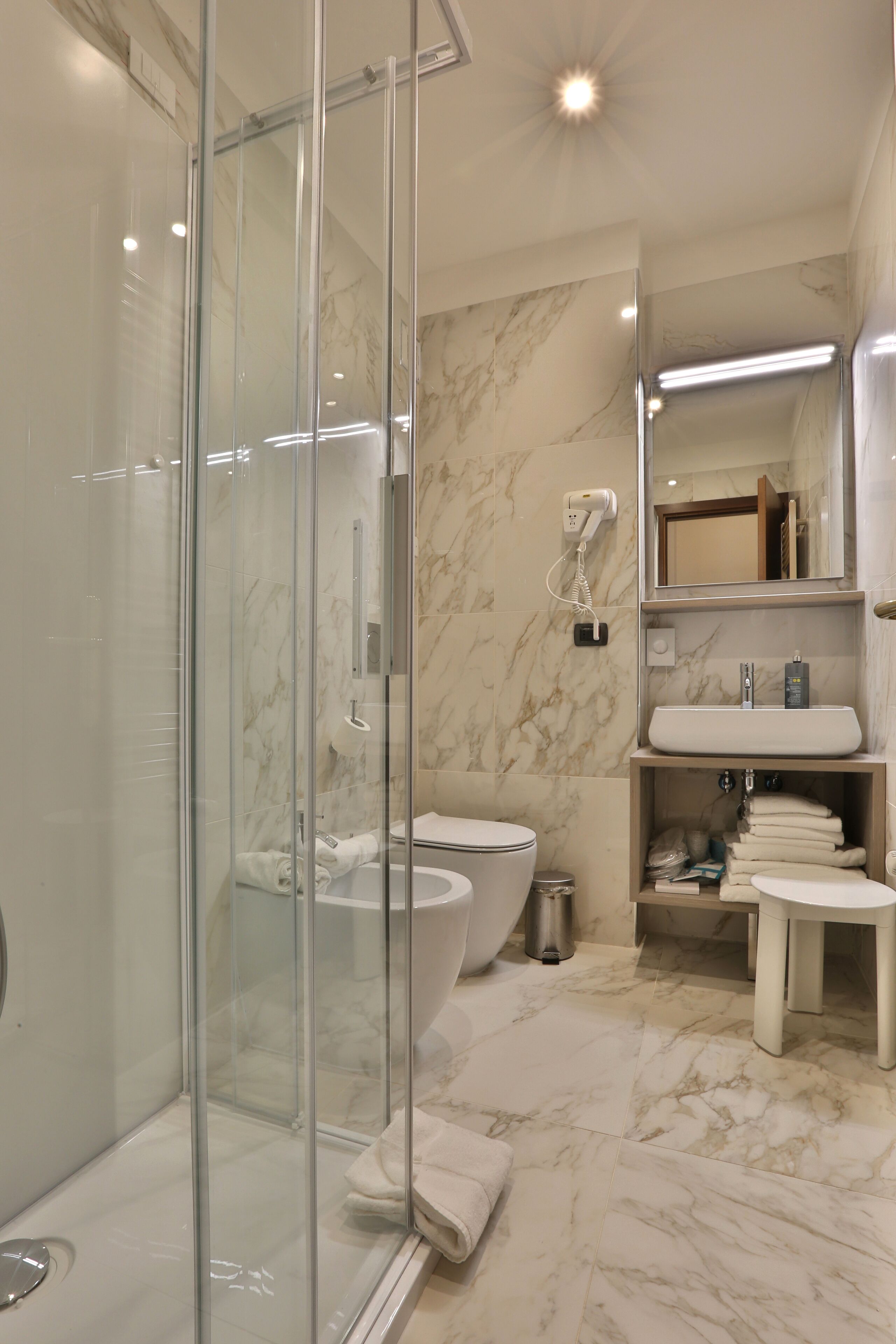 standard room | bathroom | shower, hair dryer, slippers, towels