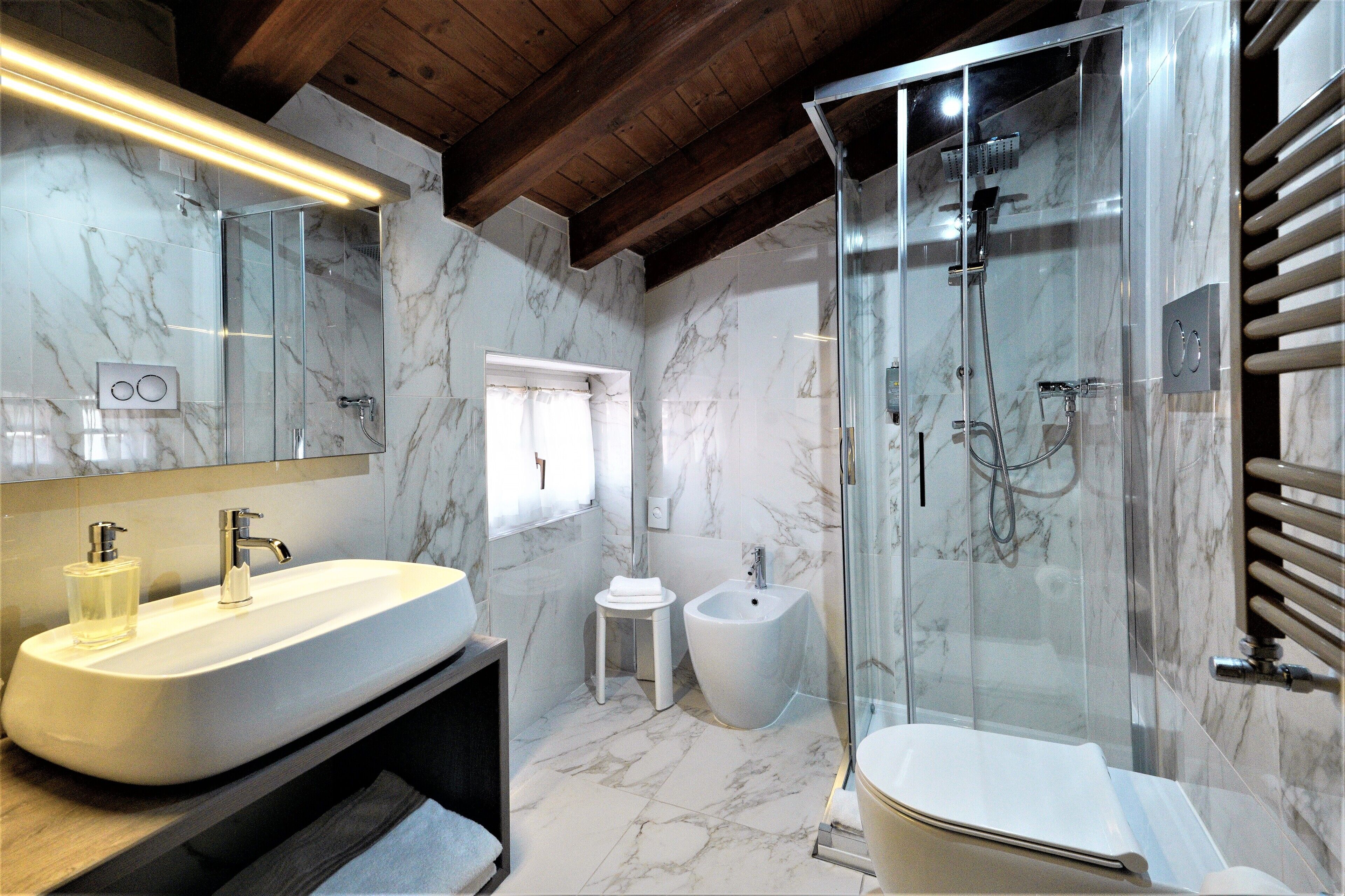 shower, hair dryer, slippers, towels