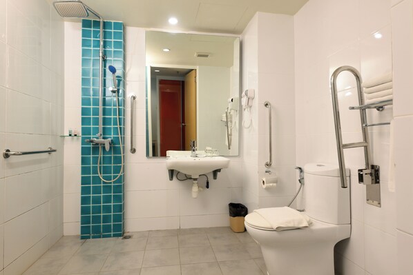 A modern bathroom with a shower, toilet, and sink. - Oceania Hotel (Kota Kinabalu)
