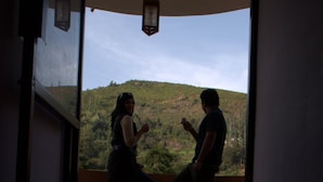A room with a view of a hilly landscape through a window. - Hotel Blue Bird (Ootacamund)