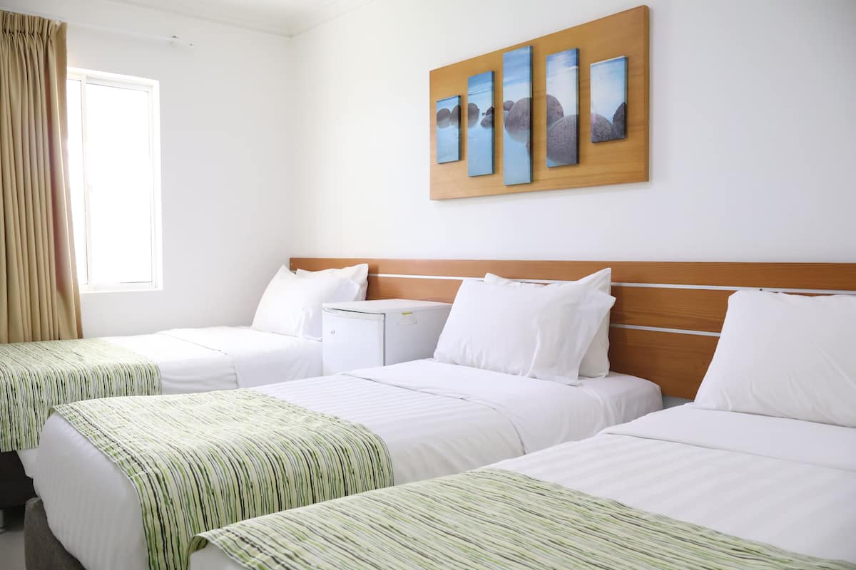 Triple Room, Garden View | Premium bedding, minibar, in-room safe, individually furnished