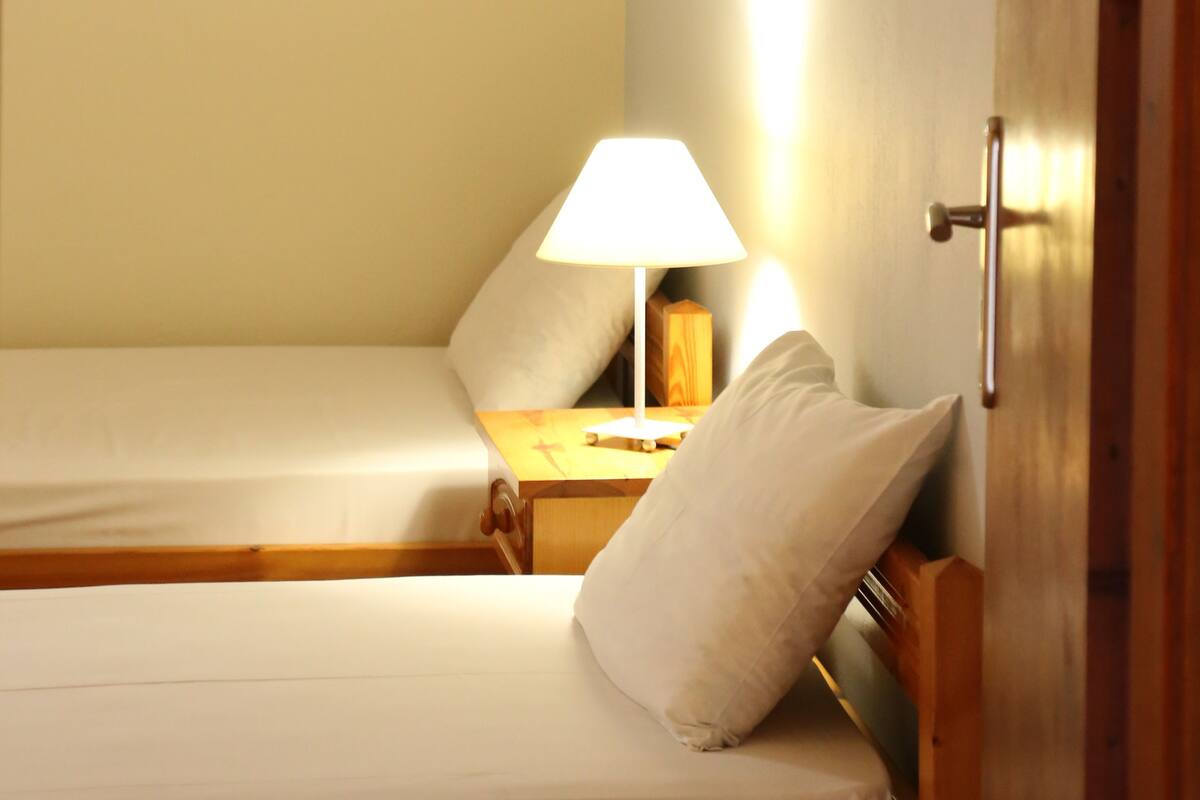 Blackout curtains, iron/ironing board, free cots/infant beds