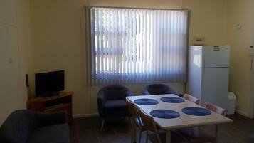 Two Bedroom Apartment - 1 Queen, 1 Double & 2 Single Beds | Living area | LED TV, DVD player