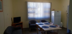Two Bedroom Apartment - 1 Queen, 1 Double & 2 Single Beds | Living area | LED TV, DVD player - Modra's Apartments (Tumby Bay)
