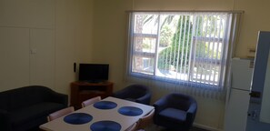 Two Bedroom Apartment - 1 Queen, 1 Double & 2 Single Beds | Living area | LED TV, DVD player - Modra's Apartments (Tumby Bay)