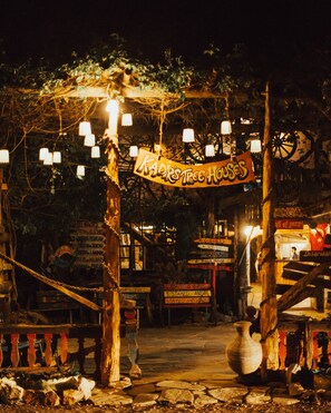 A rustic wooden archway with hanging lights and a sign reading "KADIR'S TREE HOUSE". - Kadir's Tree Houses (Kumluca)