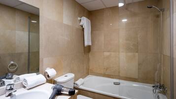 Bathtub, hair dryer, slippers, bidet