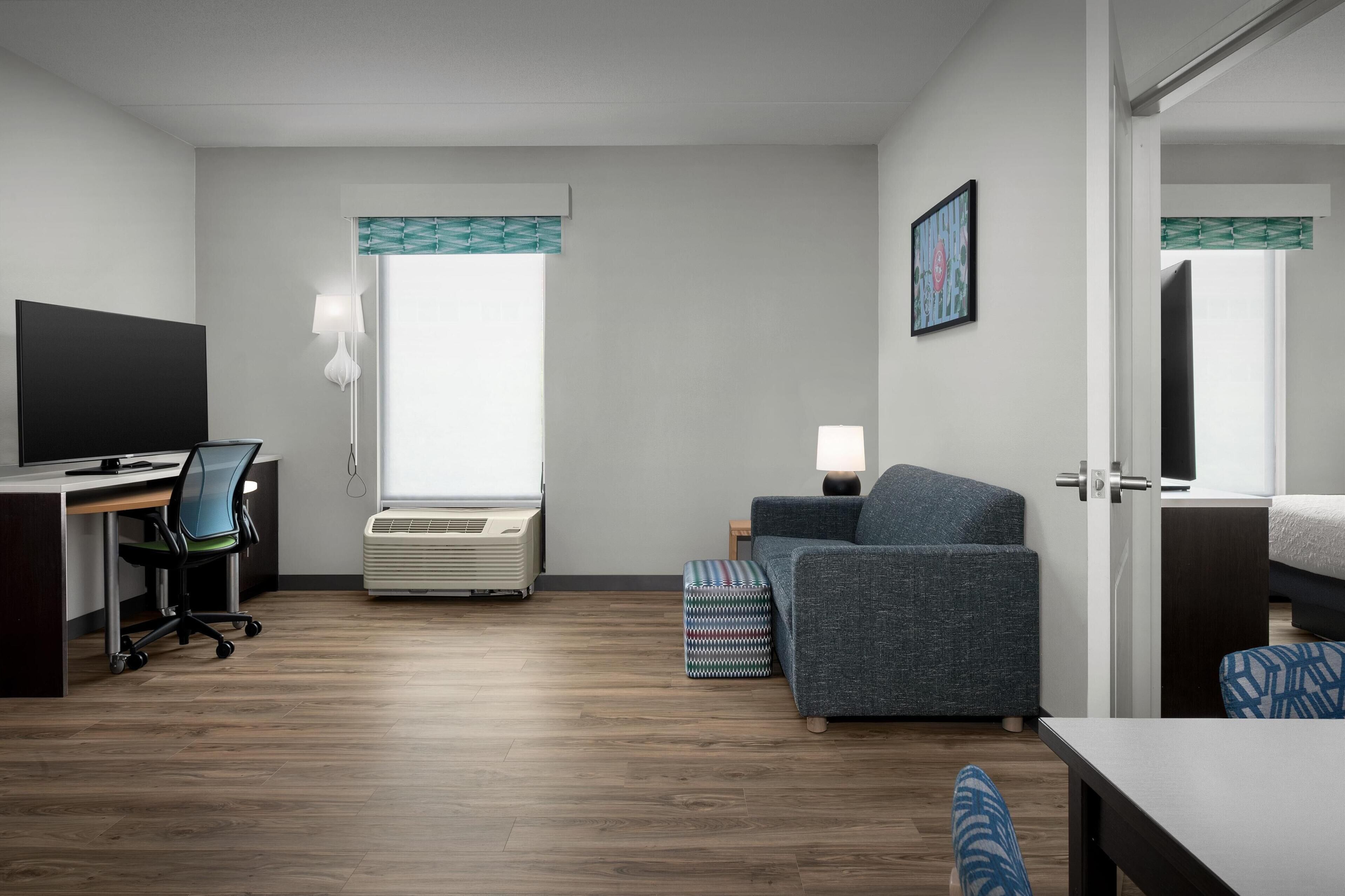 suite, 1 king bed, accessible, bathtub (mobility & hearing) | in-room safe, desk, laptop workspace, free cots/infant beds