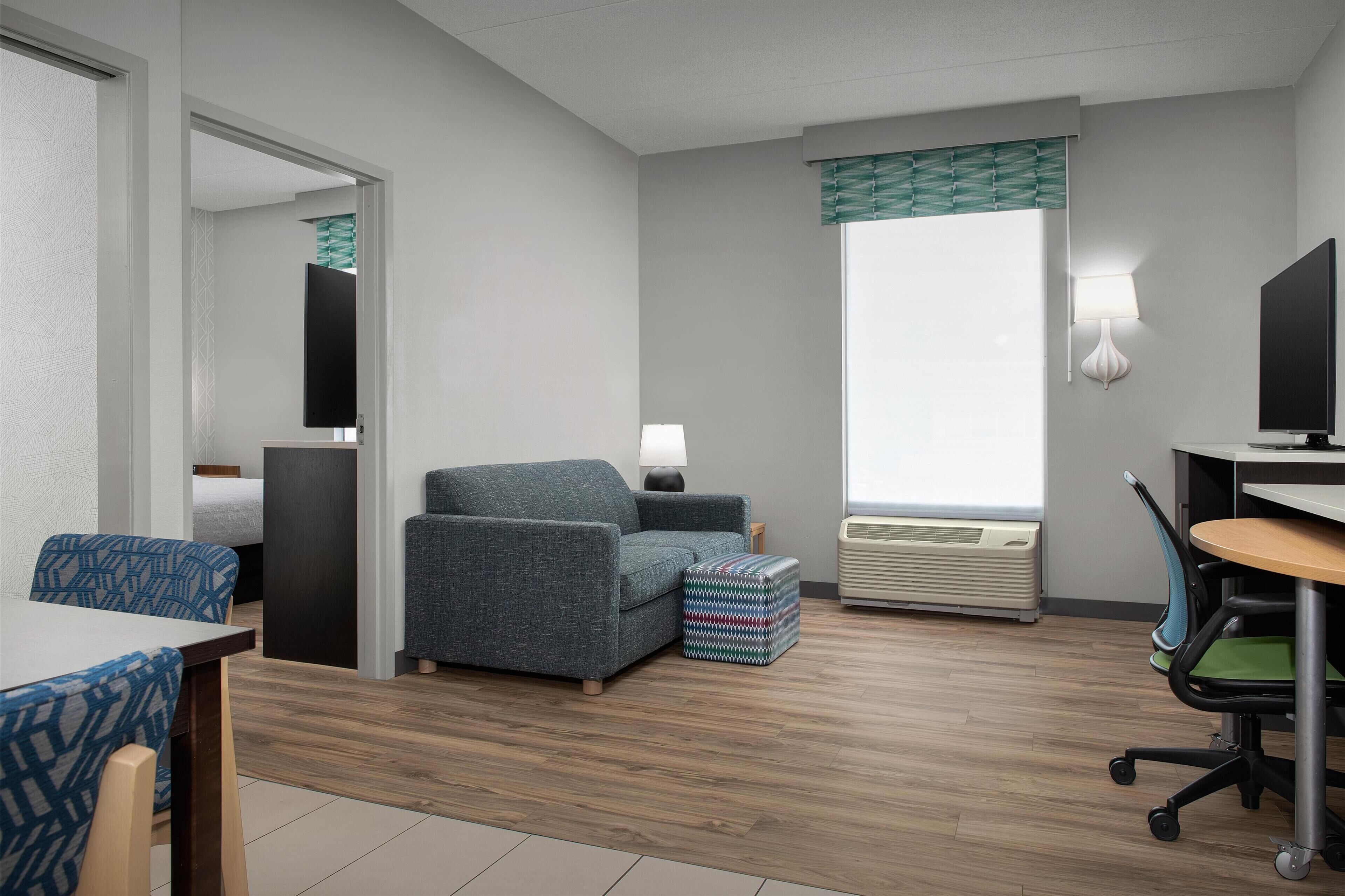 suite, 1 bedroom | living area | 42-inch flat-screen tv with premium tv channels, tv, mp3 dock