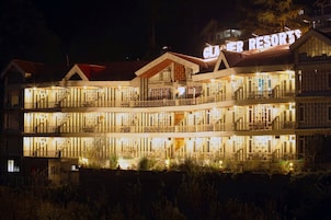 A multi-story hotel with balconies and a sign reading "ELDER RESORTS".
