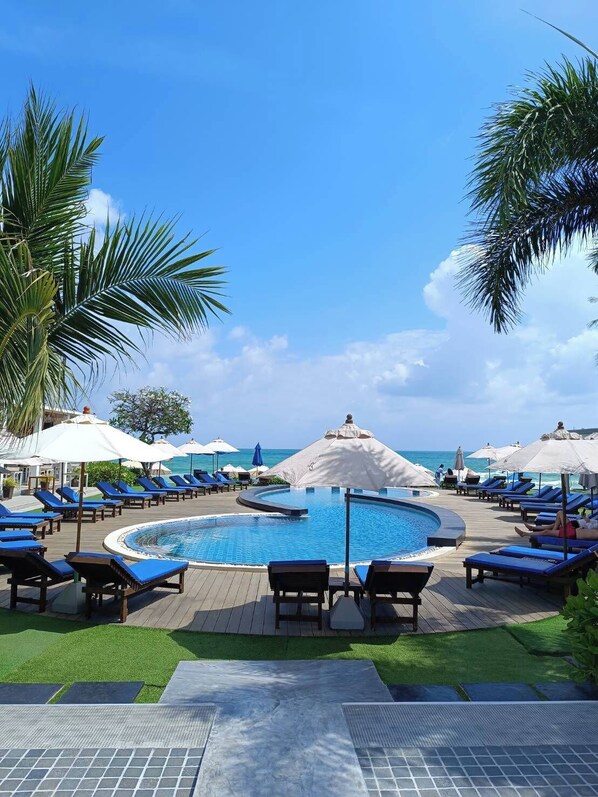 2 outdoor pools, open 7:00 AM to 7:00 PM, pool loungers