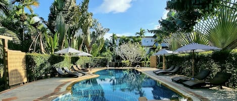 Outdoor pool, open 8:00 AM to 9:00 AM, pool loungers