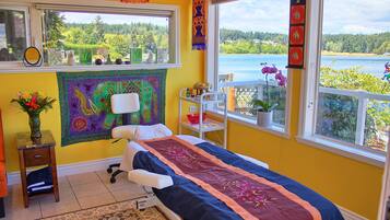 Enjoy a serene view of the lake and forest from this room's large window.