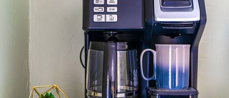 A Hamilton Beach Flexbrew coffee maker with a drip tray and a coffee pot.