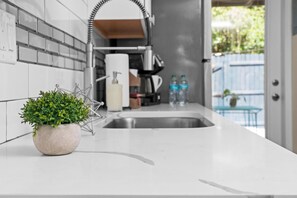 Deluxe Studio, Private Bathroom (Lily Room) | Private kitchenette | Coffee/tea maker, cookware/dishes/utensils, paper towels - The Estate at Mount Dora (Mount Dora)