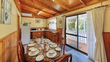 Deluxe Cottage, 2 Bedrooms | Private kitchen | Full-sized fridge, microwave, stovetop, coffee/tea maker