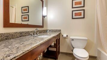 Suite, 1 King Bed, Non Smoking | Bathroom | Combined shower/tub, rainfall showerhead, hair dryer, towels