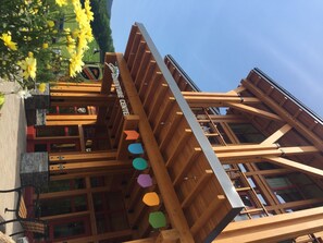 A multi-story wooden building with a sign reading "Adventure Center."