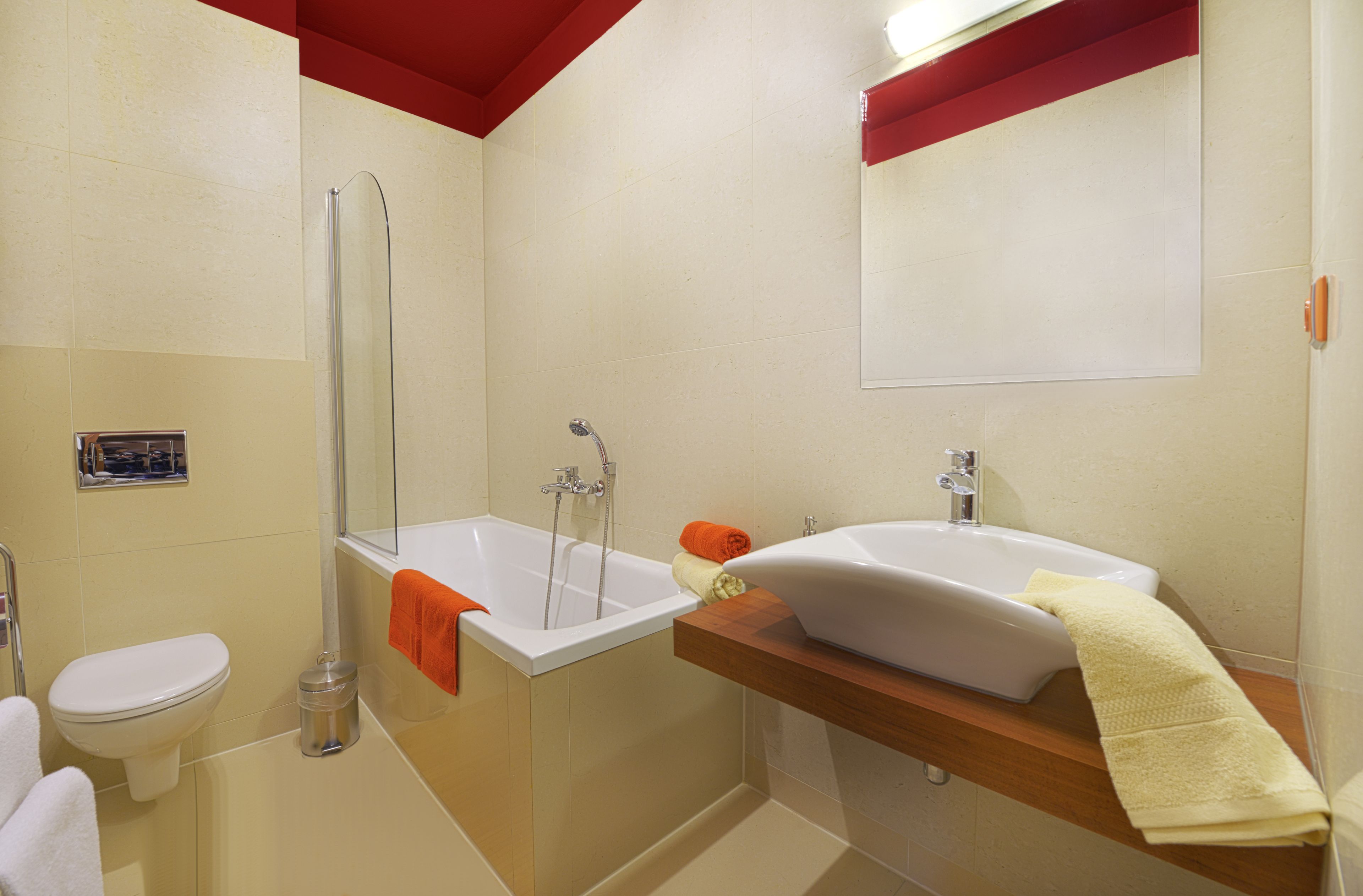 A bathroom with a bathtub, a sink, and a toilet.