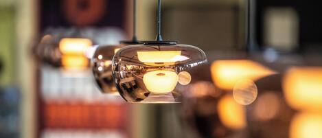 A series of hanging pendant lights with a warm glow.