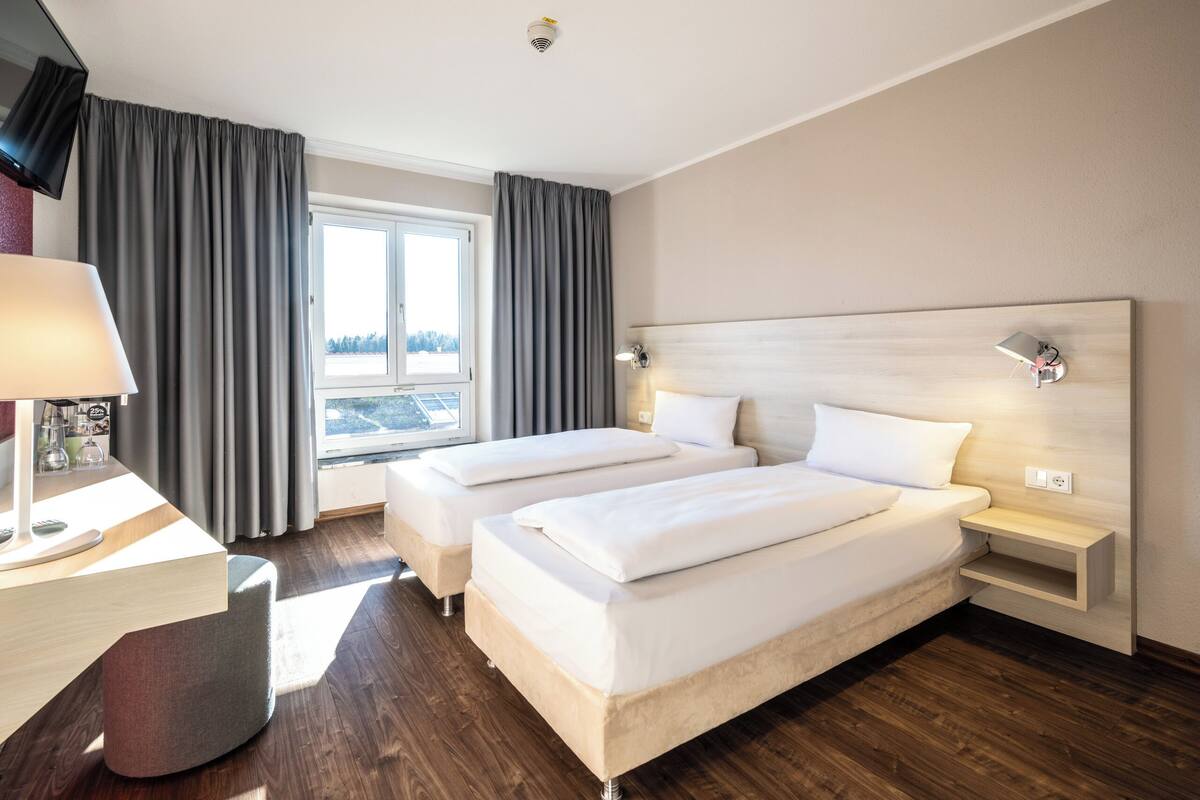 Pillow-top beds, desk, free WiFi, bed sheets