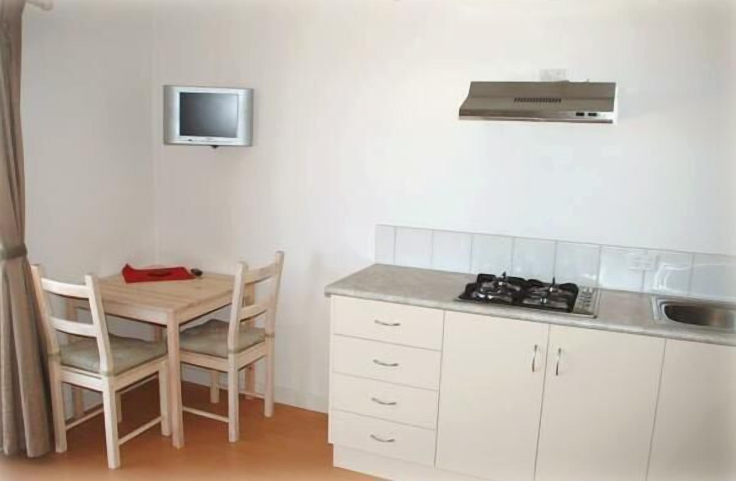 fridge, microwave, stovetop, electric kettle