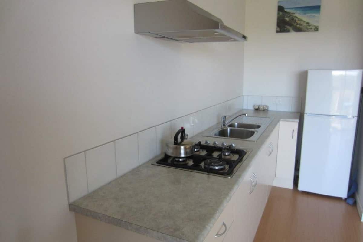 fridge, microwave, stovetop, electric kettle