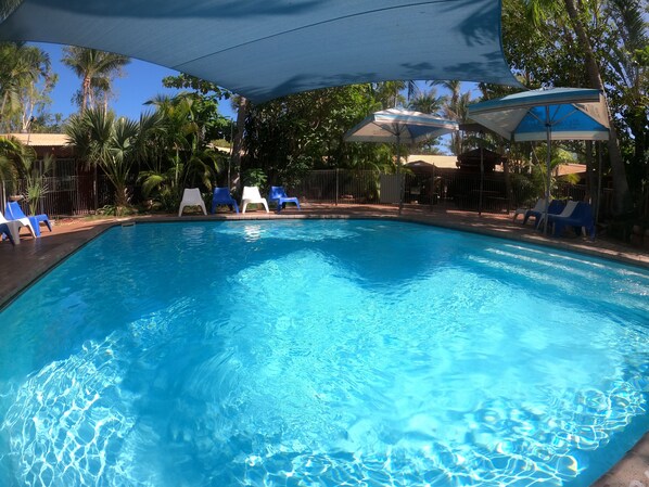 Outdoor pool, open 7 AM to 10 PM, pool loungers