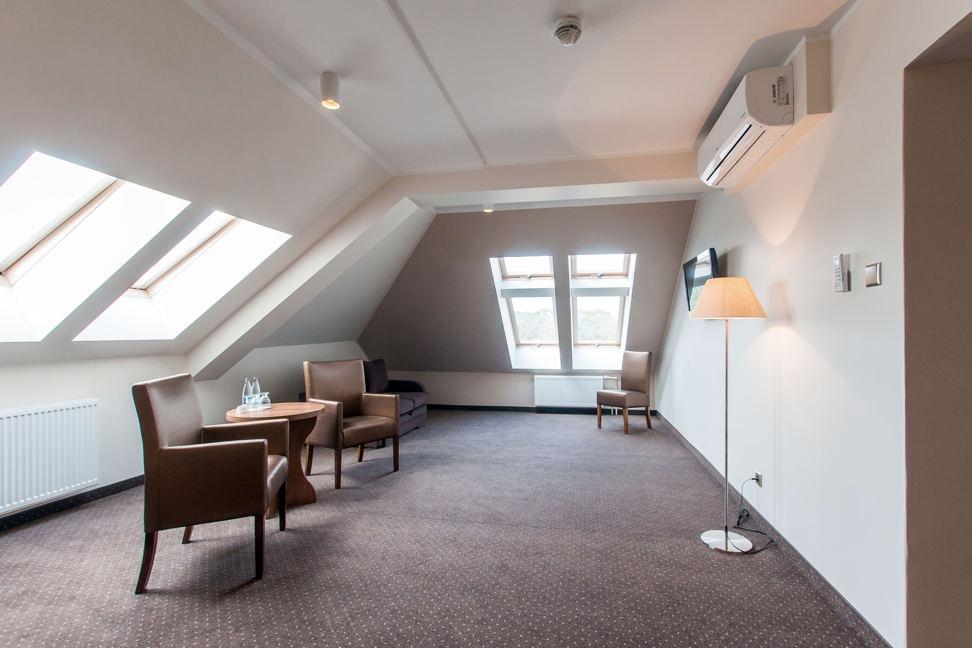 superior triple room | living area | lcd tv