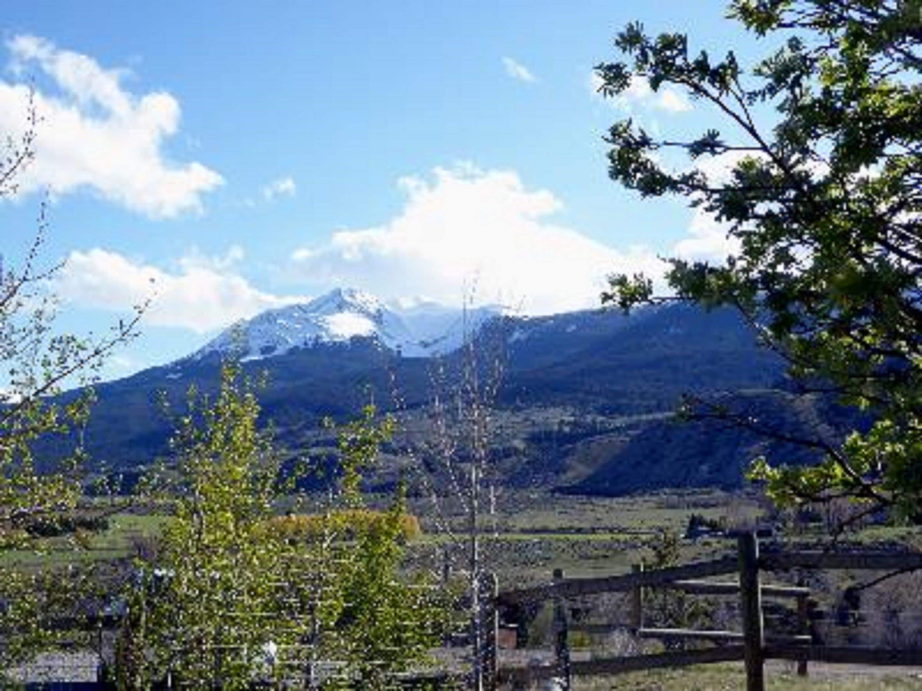 A mountain landscape with a clear sky.