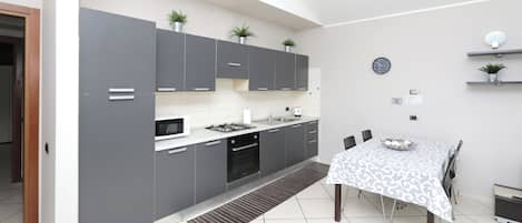 Superior Apartment | Private kitchen | Full-sized fridge, microwave, stovetop, electric kettle