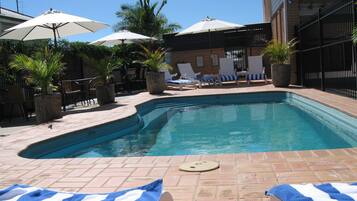 Outdoor pool, pool umbrellas, pool loungers