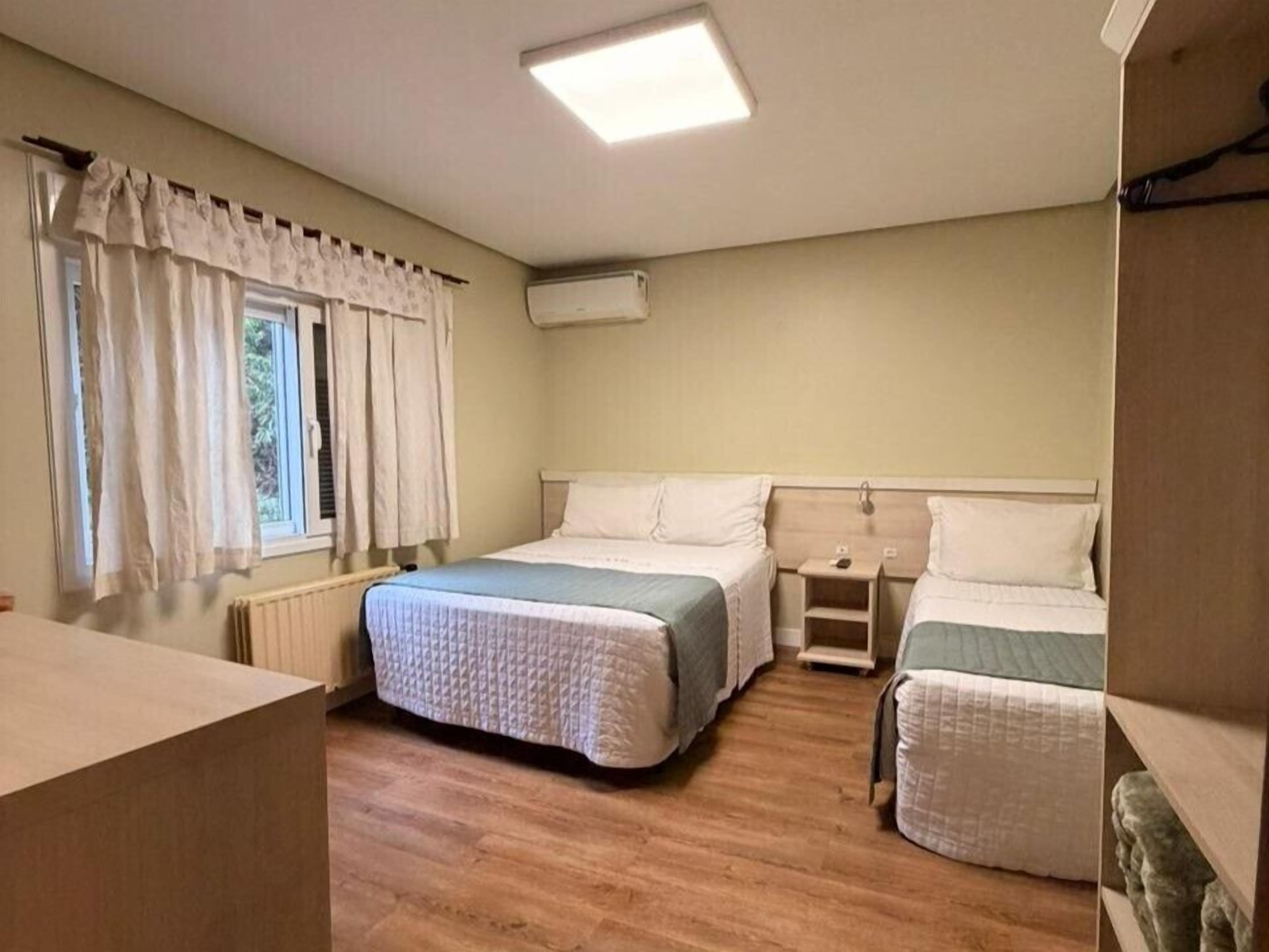 Standard Triple Room | Minibar, blackout drapes, free WiFi, bed sheets