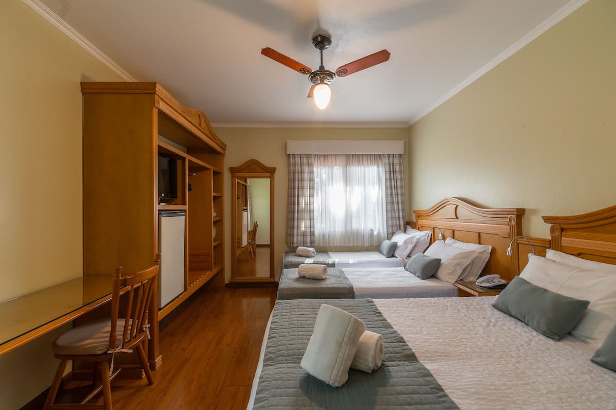 Standard Quadruple Room | Minibar, blackout drapes, free WiFi, bed sheets