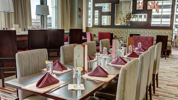 A restaurant with neatly arranged tables, chairs, and menus.