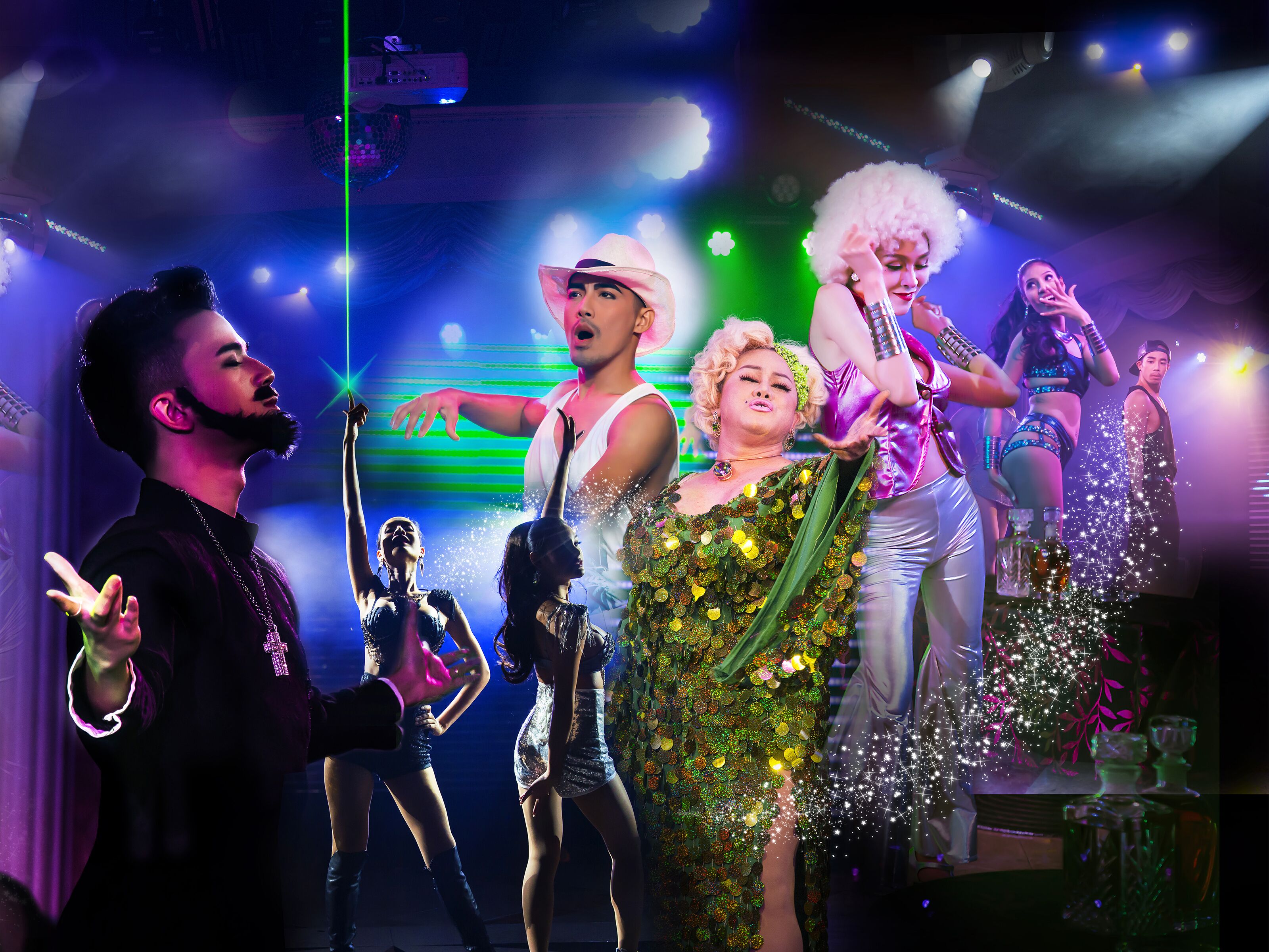 A group of people on a stage with a disco ball and stage lights.