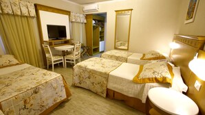 A hotel room with two beds, a desk with a chair, a television, and a wardrobe. - Life Hotel Infinity (Gramado)