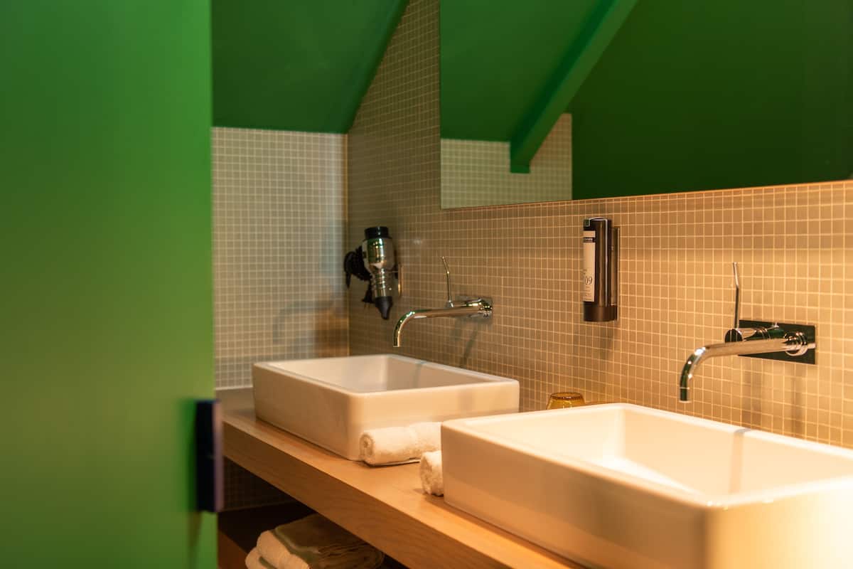 deluxe double room single use | bathroom | separate bathtub and shower, hair dryer, towels