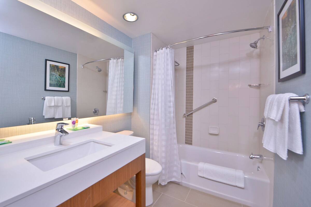 guest room, room, 2 queen beds | bathroom | designer toiletries, hair dryer, towels