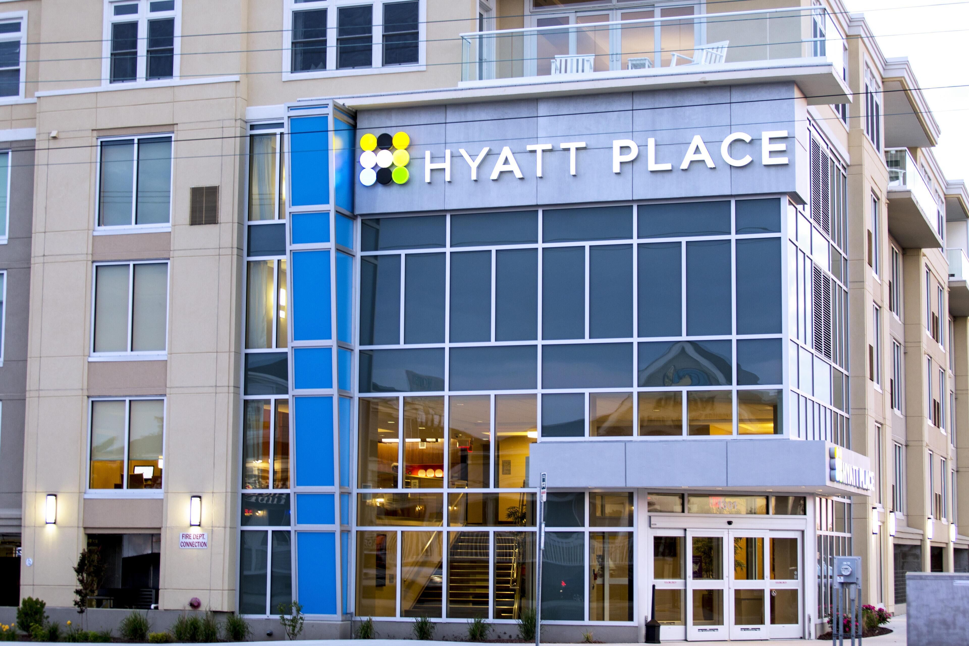 A modern building with a sign reading "HYATT PLACE".