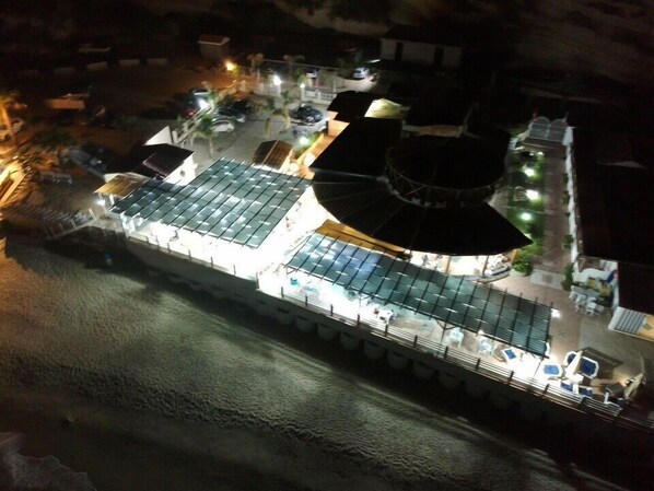 On the beach, white sand, sun-loungers, beach umbrellas