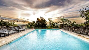 Seasonal outdoor pool, a rooftop pool, pool umbrellas, pool loungers