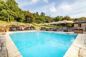 Seasonal outdoor pool, a rooftop pool, pool umbrellas, pool loungers