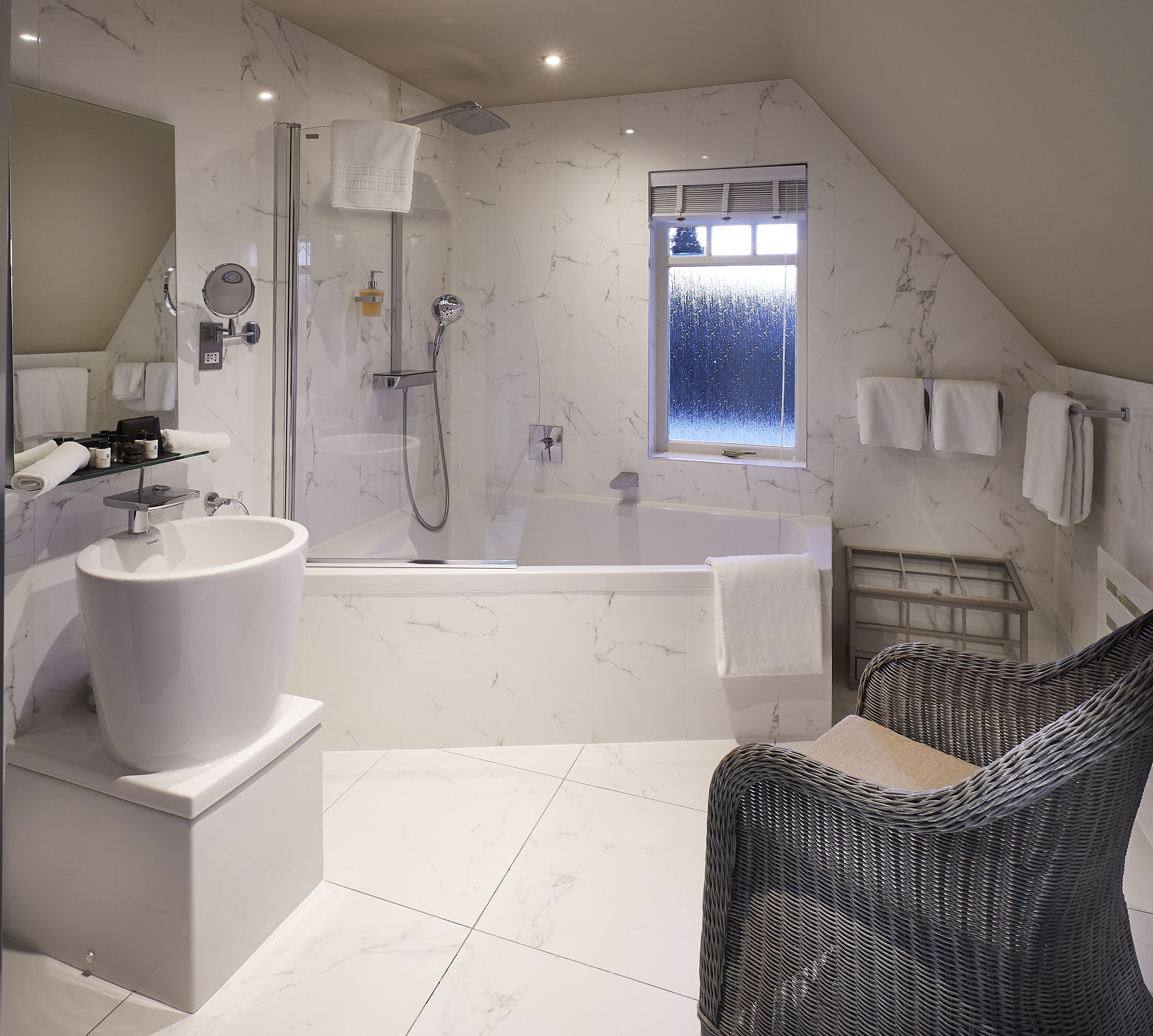 deluxe family room | bathroom | designer toiletries, hair dryer, bathrobes, slippers