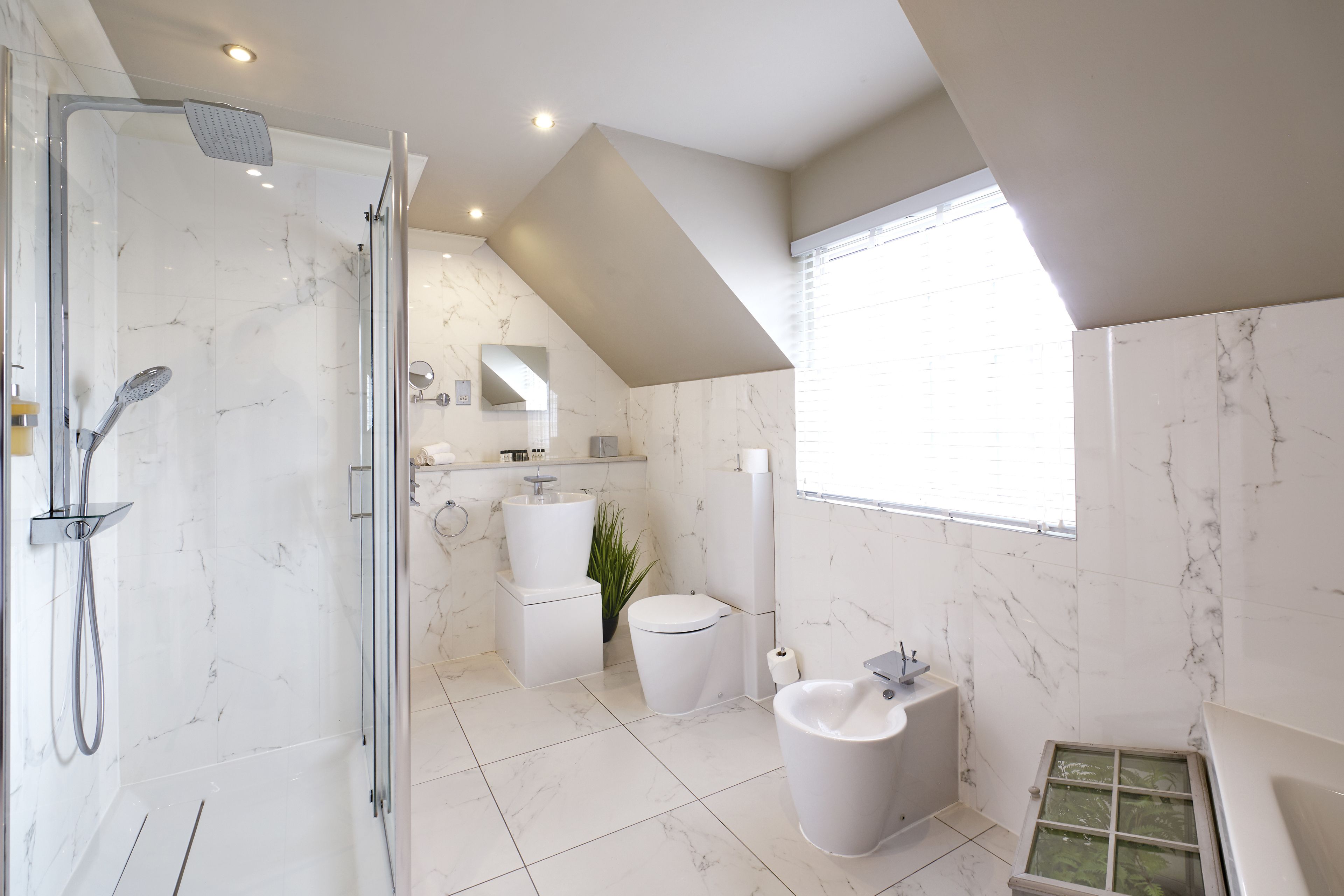 designer toiletries, hair dryer, bathrobes, slippers