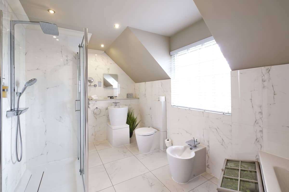 designer toiletries, hair dryer, bathrobes, slippers