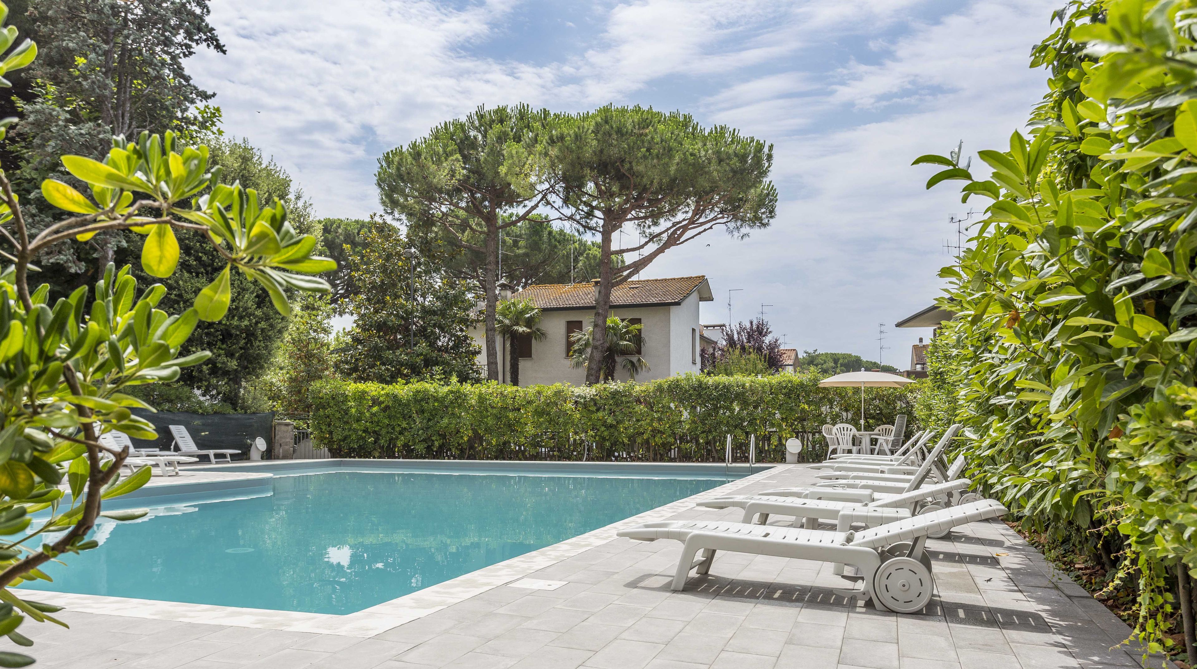 outdoor pool, pool umbrellas, pool loungers