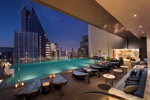 Outdoor pool, open 7:00 AM to 7:00 PM, sun loungers